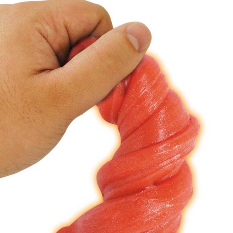 Hand twisting orange putty.